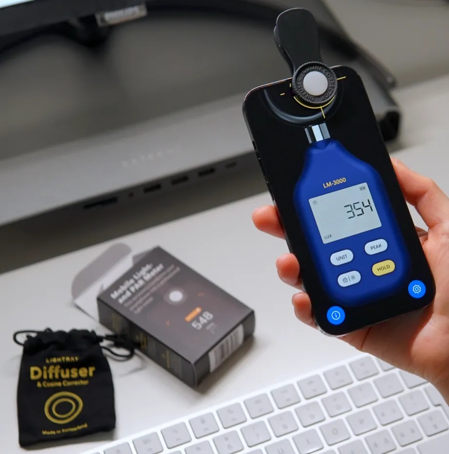 Diffuser accessory clipped onto the front camera of an iPhone running the Light Meter LM-3000